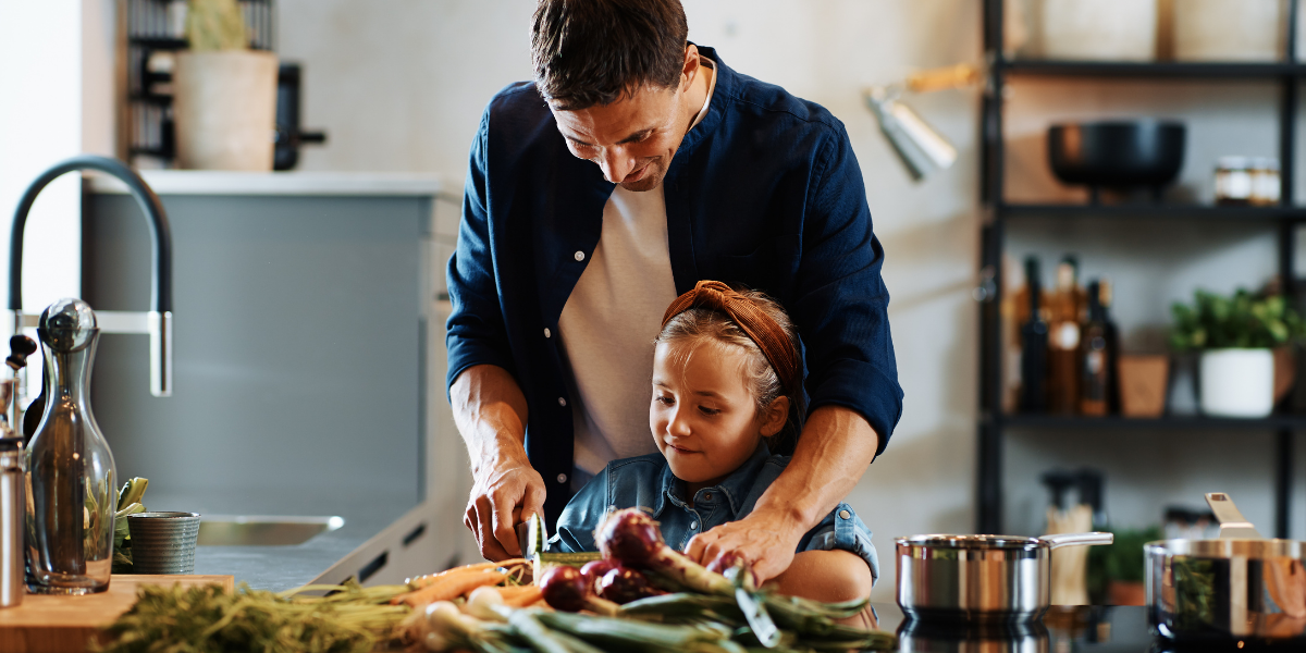 Father and daughter preparing meal